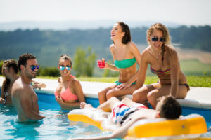 summer 2021 travel short term vacation rental swimming pool party young guest group