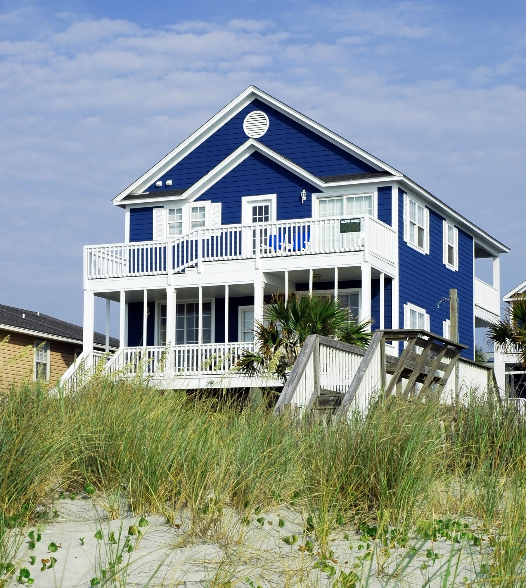 blue beach house vacation rental property manager